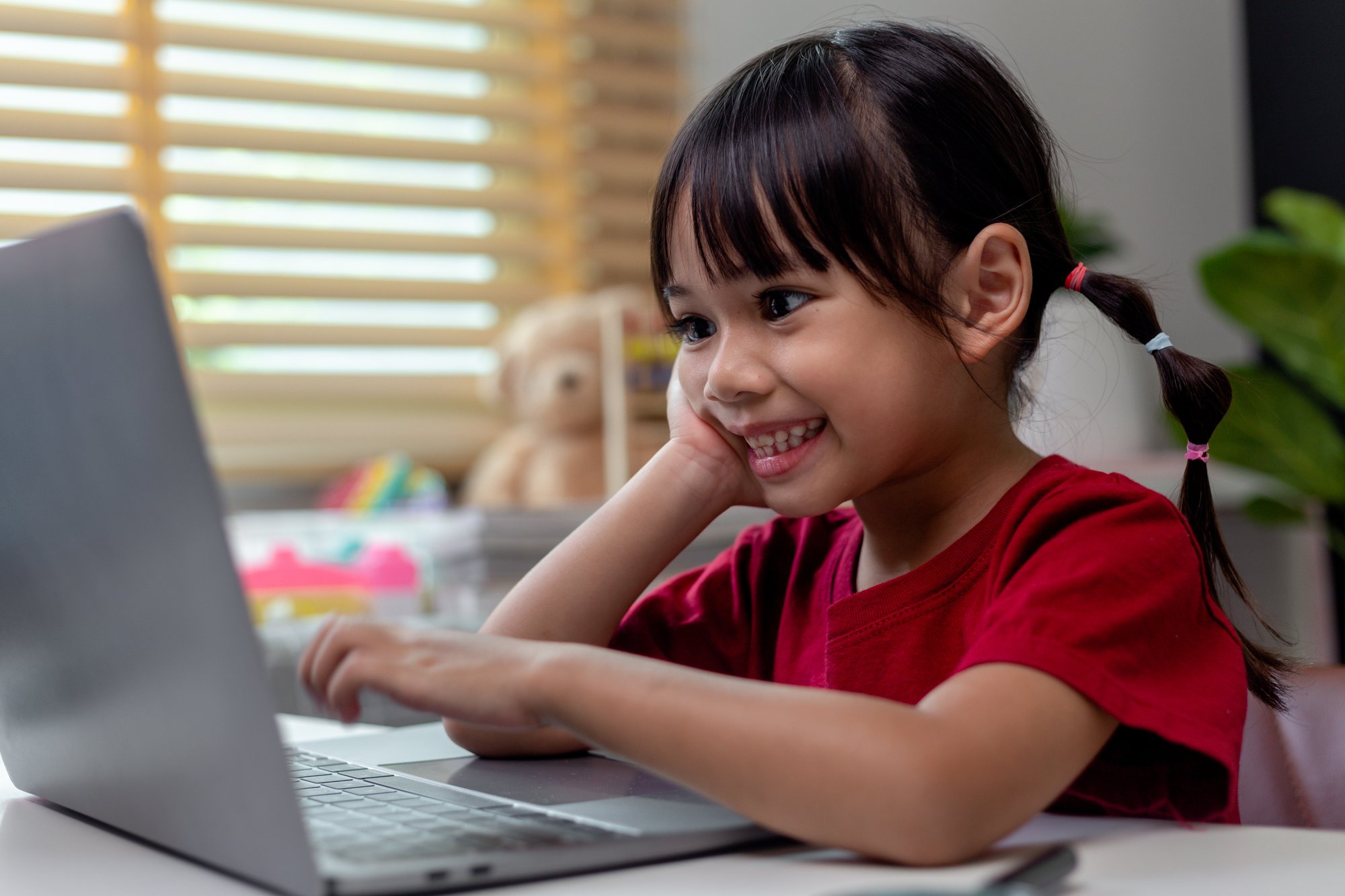 asian-girl-using-laptop-computer-for-online-study-2023-11-27-05-15-45-utc